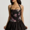 Nanala Halterneck Lace-Up Bubble Hem Mini Dress in Black Floral Print
