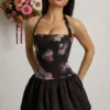 Nanala Halterneck Lace-Up Bubble Hem Mini Dress in Black Floral Print