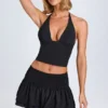 Nellary Ruffled Shirred Low-Rise Micro Mini Skirt in Black Nellary Ruffled Shirred Low-Rise Micro Mini Skirt in Black