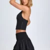 Nellary Ruffled Shirred Low-Rise Micro Mini Skirt in Black Nellary Ruffled Shirred Low-Rise Micro Mini Skirt in Black