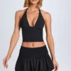 Nellary Ruffled Shirred Low-Rise Micro Mini Skirt in Black Nellary Ruffled Shirred Low-Rise Micro Mini Skirt in Black