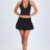 Nellary Ruffled Shirred Low-Rise Micro Mini Skirt in Black Nellary Ruffled Shirred Low-Rise Micro Mini Skirt in Black