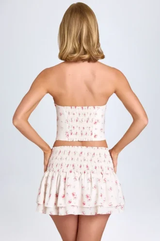 Nellary Ruffled Shirred Low-Rise Micro Mini Skirt in Small Rose Print