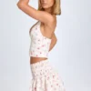 Nellary Ruffled Shirred Low-Rise Micro Mini Skirt in Small Rose Print