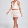 Nellary Ruffled Shirred Low-Rise Micro Mini Skirt in Small Rose Print