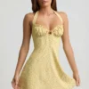 Nerine Halterneck A-Line Mini Dress in Yellow Flower Print