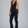 Reese Metallic Ruffle Low-Rise Flared Trousers in Black