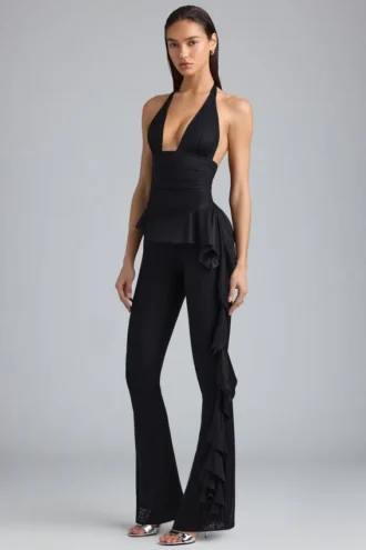Reese Metallic Ruffle Low-Rise Flared Trousers in Black