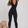 Romana Plunge Neck Ruched Waist Jumpsuit in Black