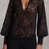 Serenya Sheer Lace Plunge-Neck Loose-Fit Playsuit in Black