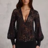 Serenya Sheer Lace Plunge-Neck Loose-Fit Playsuit in Black