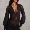 Serenya Sheer Lace Plunge-Neck Loose-Fit Playsuit in Black