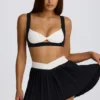 Soft Active Crossover Pleated Mini Skort in Black