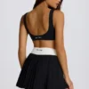 Soft Active Crossover Pleated Mini Skort in Black
