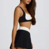 Soft Active Crossover Pleated Mini Skort in Black