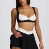 Soft Active Crossover Pleated Mini Skort in Black