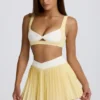 Soft Active Crossover Pleated Mini Skort in Lemon