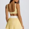 Soft Active Crossover Pleated Mini Skort in Lemon
