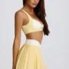 Soft Active Crossover Pleated Mini Skort in Lemon