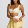 Soft Active Crossover Pleated Mini Skort in Lemon