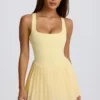 Soft Active Open-Back Pleated Tennis Dress in Lemon
