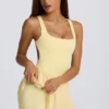 Soft Active Open-Back Pleated Tennis Dress in Lemon