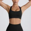 Super Sculpt Seamless T-Back Sports Bra in Black