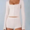Amoura Knit Mid-Rise Mini Shorts in Ivory