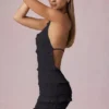 Tarryn Ruffled Backless Halterneck Mini Dress in Black