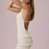 Tarryn Ruffled Backless Halterneck Mini Dress in Ivory