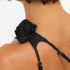 Tesia Slinky Jersey Rose Detail Asymmetric Top in Black