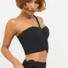 Tesia Slinky Jersey Rose Detail Asymmetric Top in Black