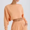 Textured Cotton Jersey Open-Back Cropped Sweatshirt in Peach