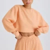 Textured Cotton Jersey Open-Back Cropped Sweatshirt in Peach