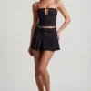 Velora Belted Low-Rise Pleated Mini Skirt in Black